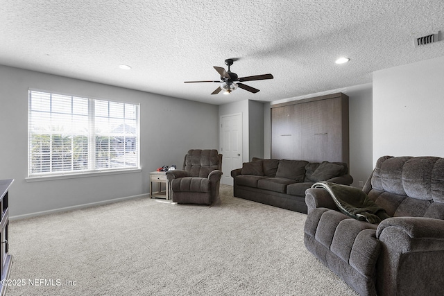 living area with visible vents, a ceiling fan, recessed lighting, carpet flooring, and baseboards