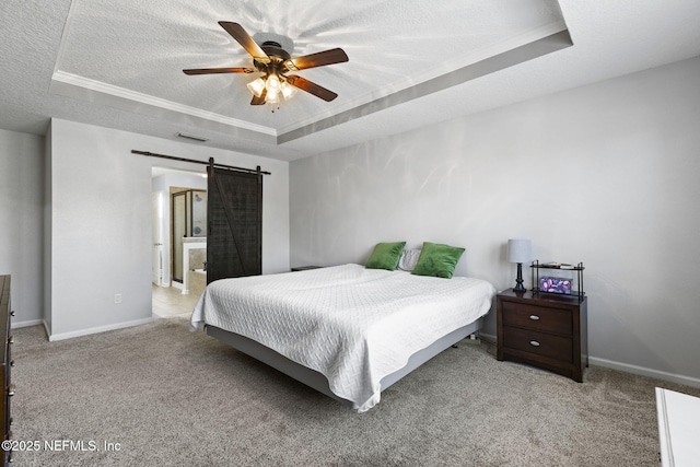 bedroom with visible vents, a raised ceiling, a textured ceiling, and carpet flooring