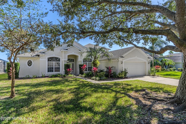 mediterranean / spanish house featuring an attached garage, a front lawn, concrete driveway, and stucco siding