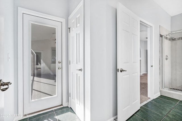 interior space with dark tile patterned flooring