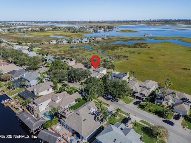 aerial view with a residential view and a water view