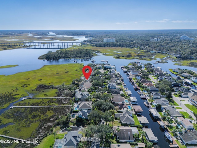 drone / aerial view featuring a residential view and a water view