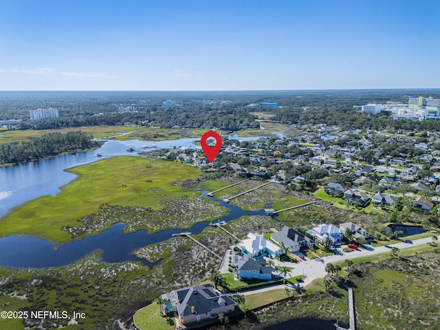 birds eye view of property featuring a water view