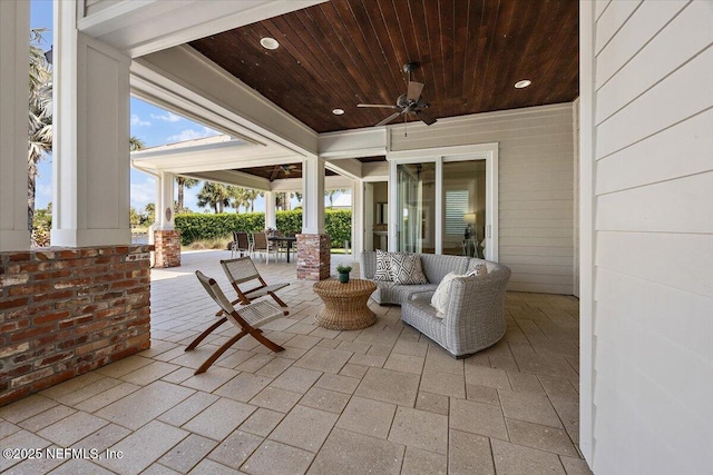 view of patio featuring outdoor dining space and ceiling fan