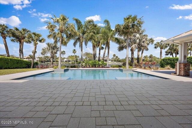 outdoor pool featuring a patio