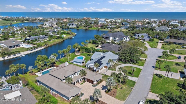 bird's eye view featuring a residential view and a water view