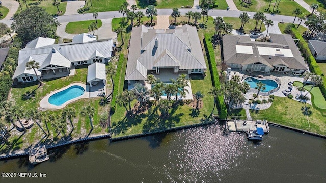 birds eye view of property featuring a residential view and a water view