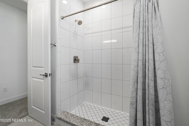 bathroom with tiled shower