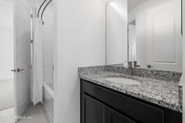 bathroom with shower / bathtub combination with curtain, vanity, and tile patterned floors