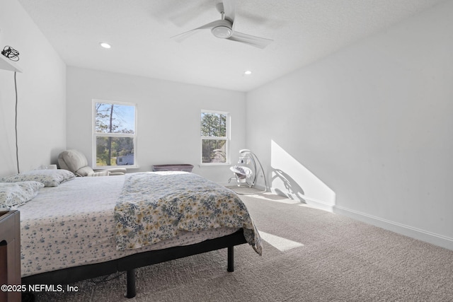 carpeted bedroom with ceiling fan, recessed lighting, and baseboards