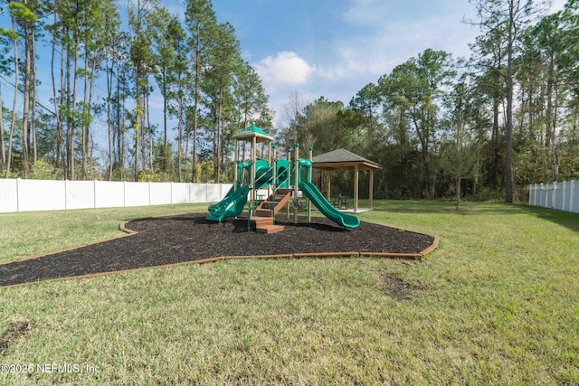 community playground with fence and a lawn