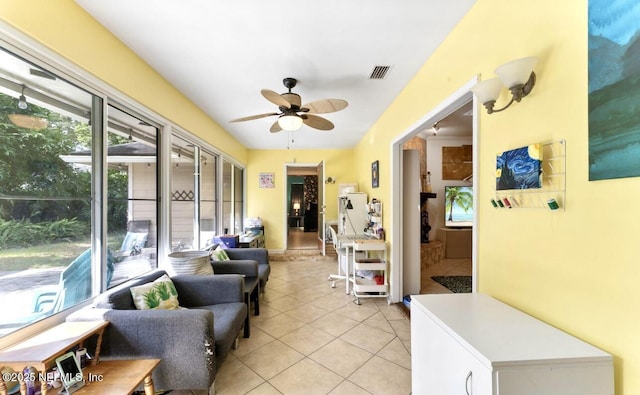 sunroom with visible vents and a ceiling fan