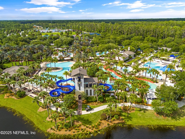 bird's eye view with a wooded view and a water view