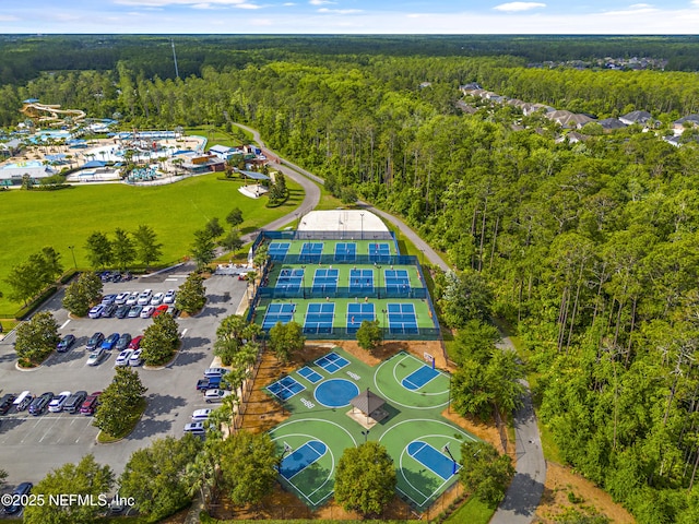 birds eye view of property with a view of trees