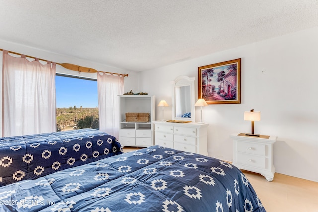 bedroom featuring a textured ceiling