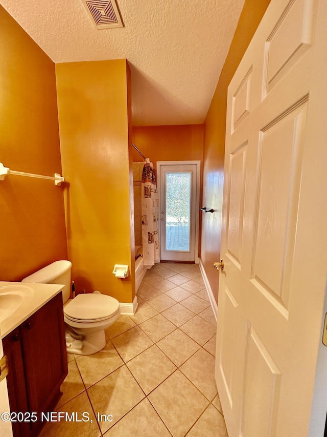 full bathroom featuring visible vents, toilet, shower / tub combo, vanity, and tile patterned floors