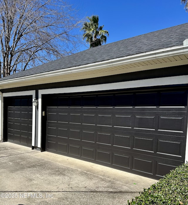 garage featuring driveway