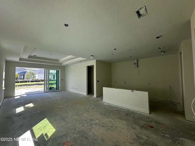 36 Aspendale Rd, Ponte Vedra, FL 32081 - unfurnished living room featuring a raised ceiling and a textured ceiling
