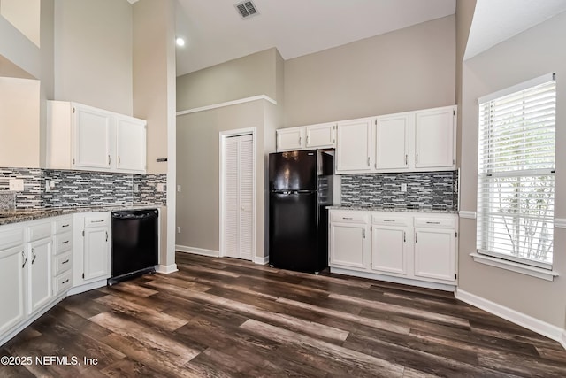 kitchen featuring black appliances, visible vents, white cabinets, and light stone counters