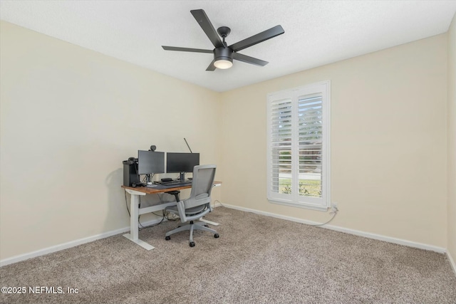 office area with a ceiling fan, carpet, a textured ceiling, and baseboards