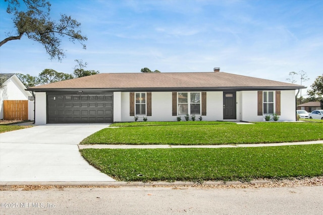 single story home featuring a garage, a front yard, driveway, and fence