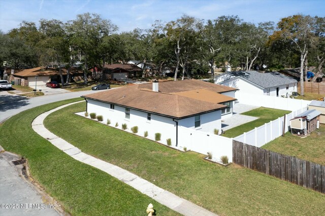 birds eye view of property with a residential view