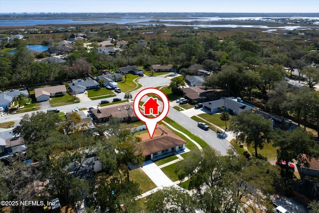 drone / aerial view with a water view and a residential view