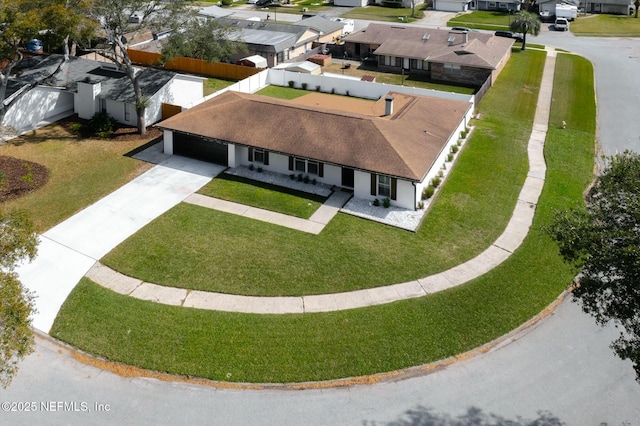 birds eye view of property with a residential view