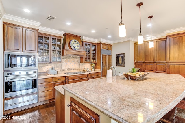 kitchen with built in appliances, visible vents, ornamental molding, decorative backsplash, and a warming drawer