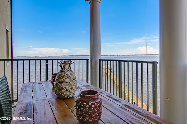 wooden deck featuring a water view