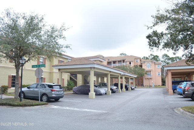 view of partially covered parking lot