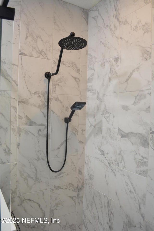 details featuring a tile shower