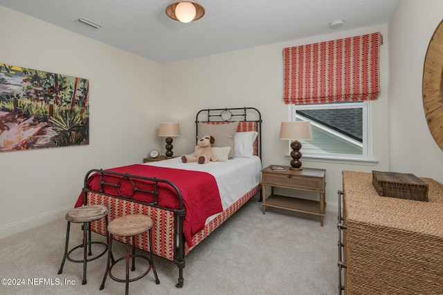 bedroom featuring carpet, visible vents, and baseboards