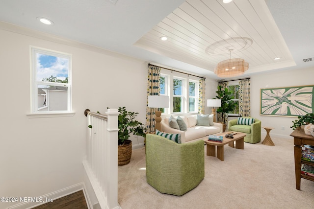 living room featuring recessed lighting, a raised ceiling, visible vents, and baseboards