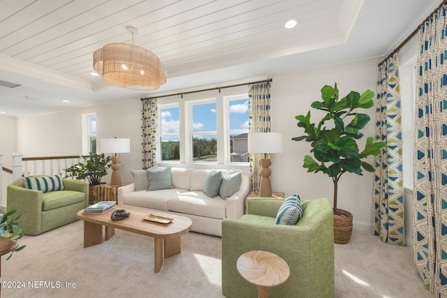 living room with carpet floors, a tray ceiling, wooden ceiling, and crown molding