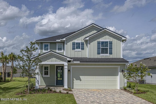 336 Blue Hampton Dr, Ponte Vedra, FL 32081 - view of front of house with decorative driveway, board and batten siding, an attached garage, a front yard, and a porch