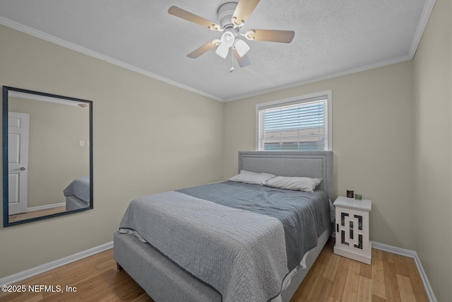 2107 2nd St S, Jacksonville Beach, FL 32250 - bedroom with a textured ceiling, baseboards, and wood finished floors