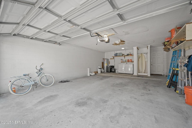 2107 2nd St S, Jacksonville Beach, FL 32250 - garage with washer and dryer, a garage door opener, and water heater