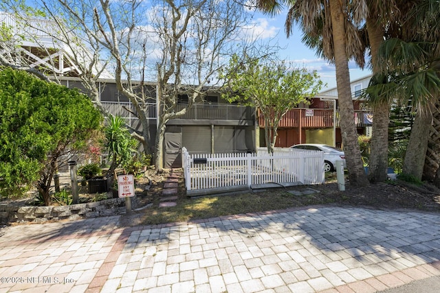 2107 2nd St S, Jacksonville Beach, FL 32250 - back of property with a balcony and fence
