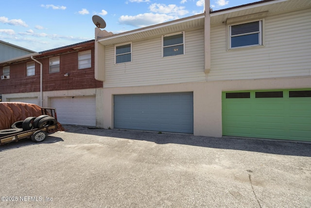 2107 2nd St S, Jacksonville Beach, FL 32250 - view of front of property featuring driveway and a garage