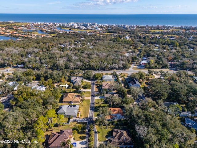 birds eye view of property with a water view and a residential view