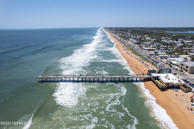 bird's eye view featuring a water view and a view of the beach