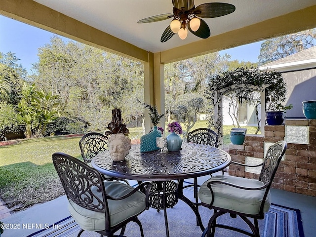 view of patio / terrace with outdoor dining space and ceiling fan