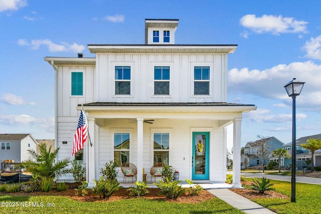 view of front of home featuring board and batten siding and covered porch