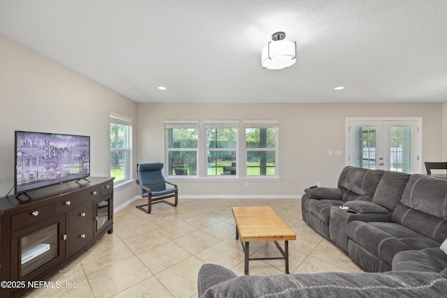 living area featuring french doors, recessed lighting, baseboards, and light tile patterned floors