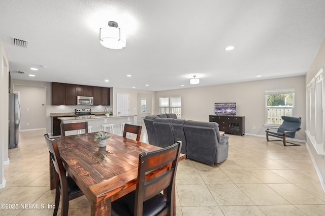 dining room featuring visible vents, recessed lighting, baseboards, and light tile patterned flooring
