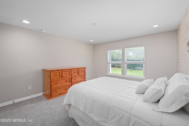 bedroom with baseboards, light carpet, and recessed lighting