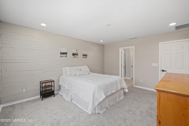 bedroom featuring baseboards, light colored carpet, recessed lighting, and visible vents