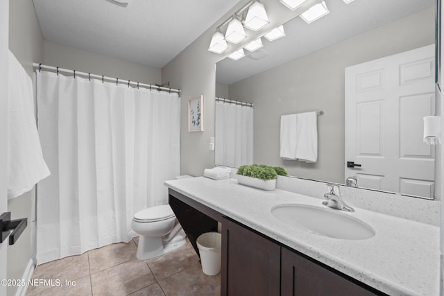 full bath featuring tile patterned floors, vanity, and toilet