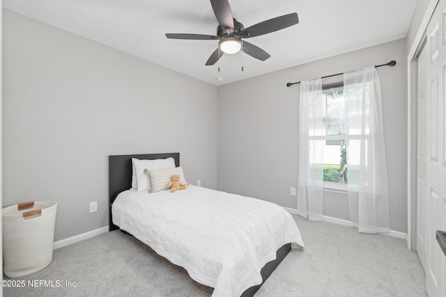 bedroom featuring carpet flooring, a ceiling fan, and baseboards